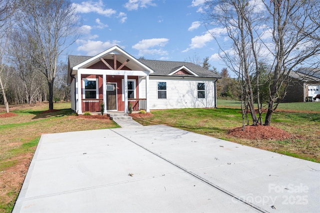 bungalow-style home with a front lawn