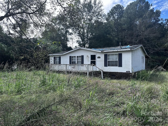 view of front of house with a wooden deck