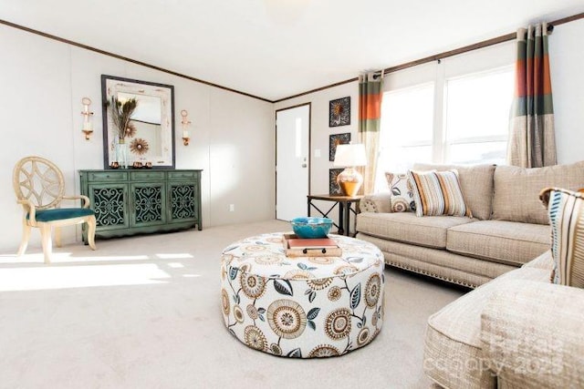 living room with carpet floors, lofted ceiling, and ornamental molding