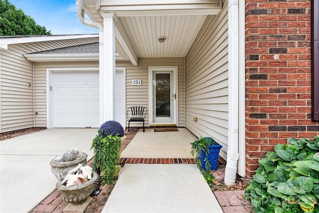 doorway to property featuring a garage