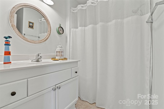 bathroom with tile patterned floors and vanity