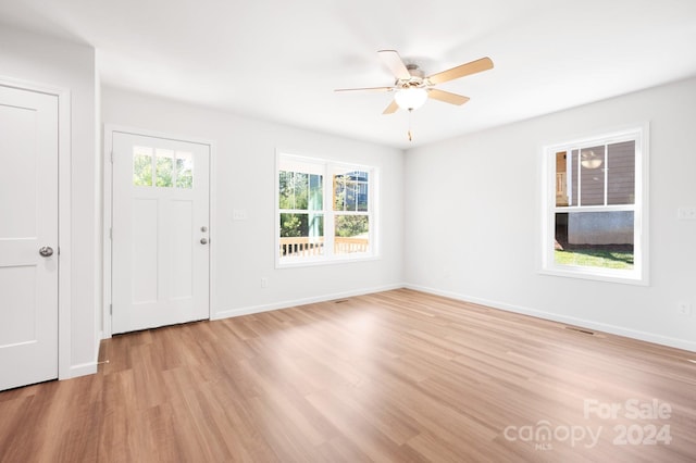 entryway with light hardwood / wood-style floors and ceiling fan