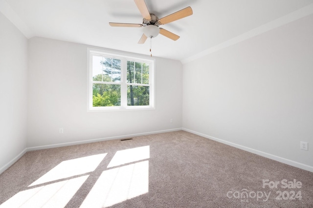 unfurnished room featuring ceiling fan and carpet floors