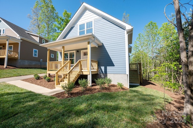 view of front of house featuring a porch and a front lawn