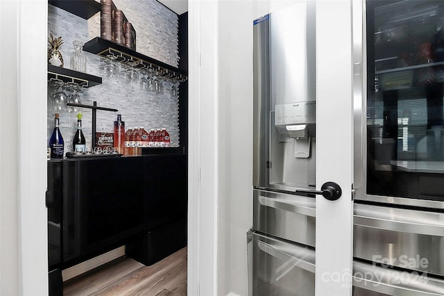 interior space featuring hardwood / wood-style floors and tasteful backsplash