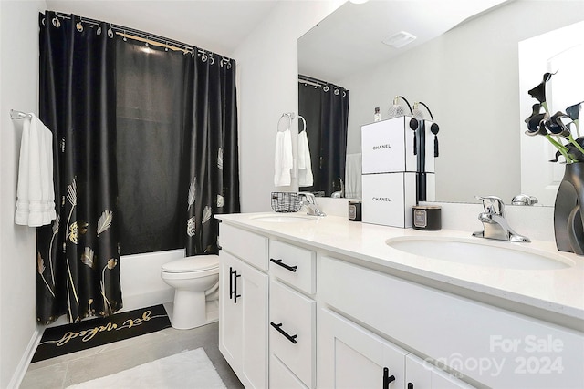 full bathroom with shower / tub combo with curtain, vanity, toilet, and tile patterned floors