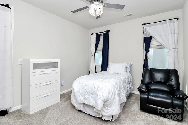 carpeted bedroom with ceiling fan