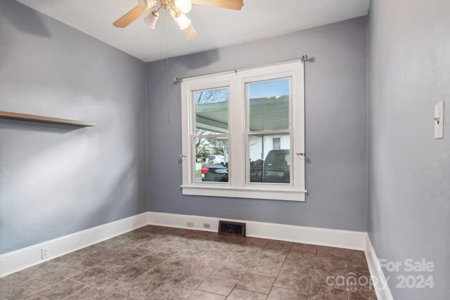 spare room with ceiling fan