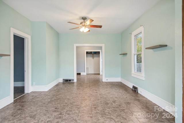 empty room with ceiling fan