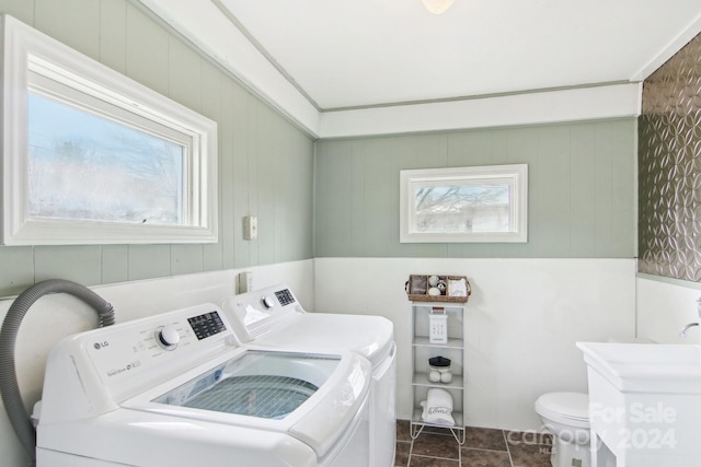 clothes washing area with washer and clothes dryer