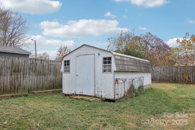 view of outdoor structure with a lawn