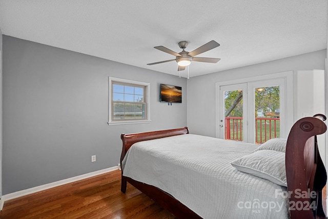 bedroom featuring ceiling fan, hardwood / wood-style flooring, a textured ceiling, and access to exterior