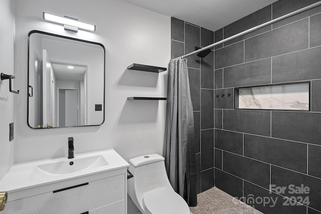 bathroom featuring vanity, toilet, and a shower with shower curtain