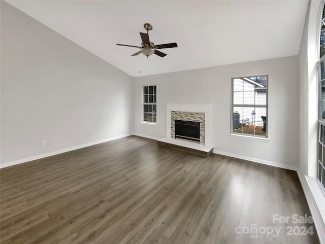 unfurnished living room featuring ceiling fan, vaulted ceiling, and dark hardwood / wood-style floors