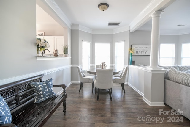 dining space featuring dark wood-type flooring and ornamental molding