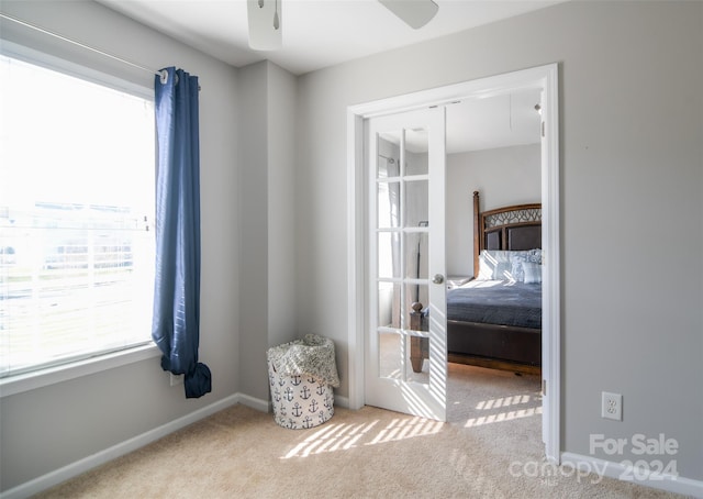 unfurnished bedroom with ceiling fan, light colored carpet, and a closet