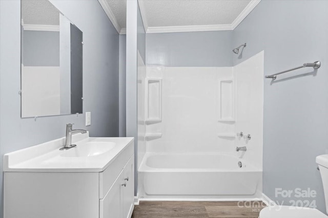 full bathroom featuring vanity, a textured ceiling, toilet, and shower / bath combination