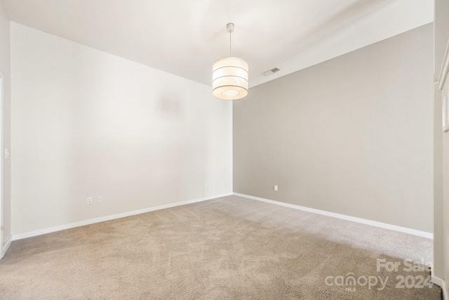 unfurnished room featuring carpet floors