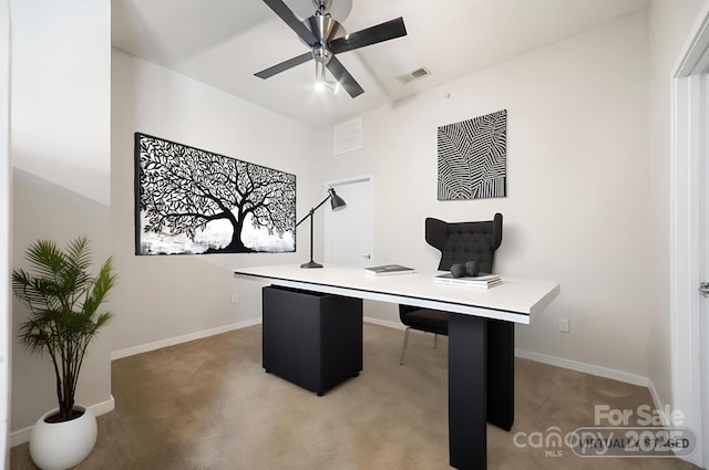 office with light carpet, baseboards, visible vents, and a ceiling fan