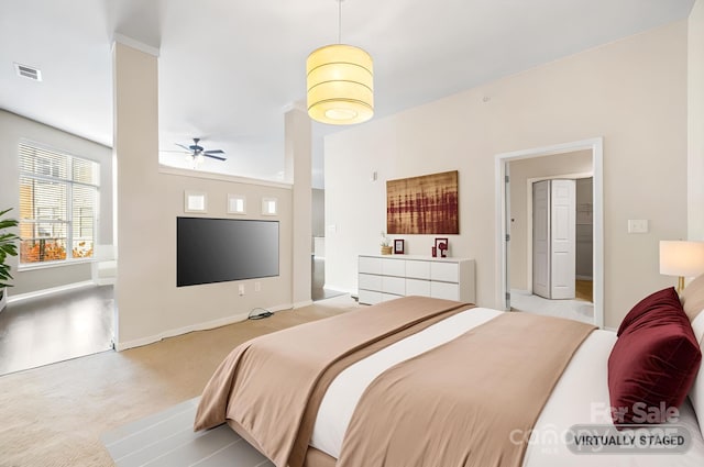 carpeted bedroom with baseboards and visible vents