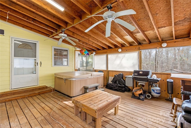 sunroom / solarium with vaulted ceiling with beams, a hot tub, and ceiling fan