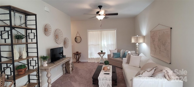 living room with ceiling fan and carpet