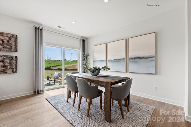 dining area with light wood-type flooring