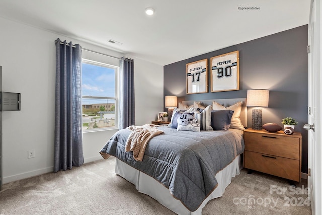 bedroom with light colored carpet