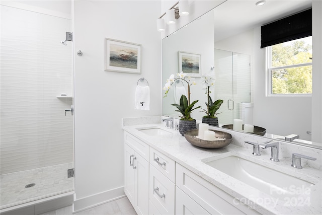 bathroom with vanity and walk in shower