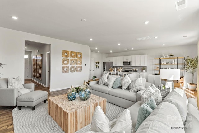 living room with light hardwood / wood-style flooring