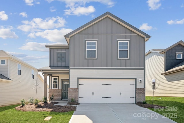 view of front of house featuring an attached garage, concrete driveway, board and batten siding, and brick siding