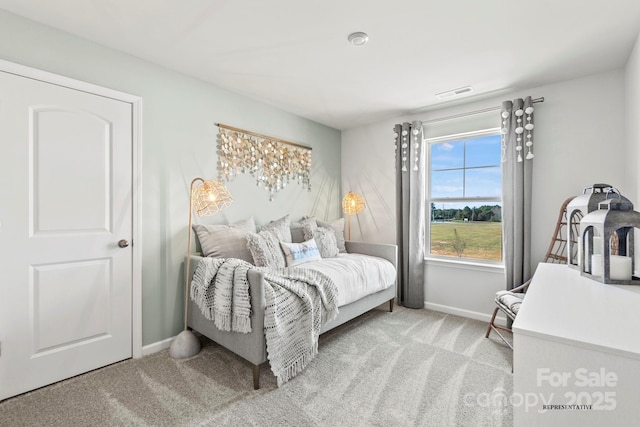 bedroom with carpet flooring, visible vents, and baseboards