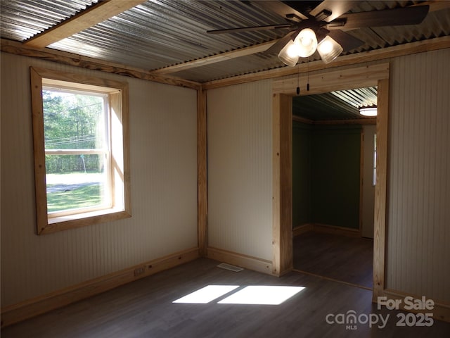 unfurnished bedroom featuring baseboards and wood finished floors