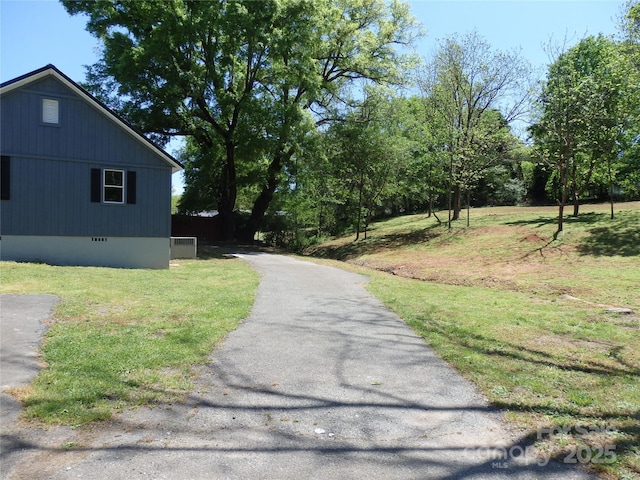 view of road featuring aphalt driveway