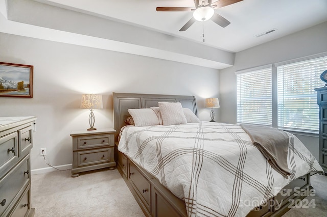 bedroom with ceiling fan and light colored carpet