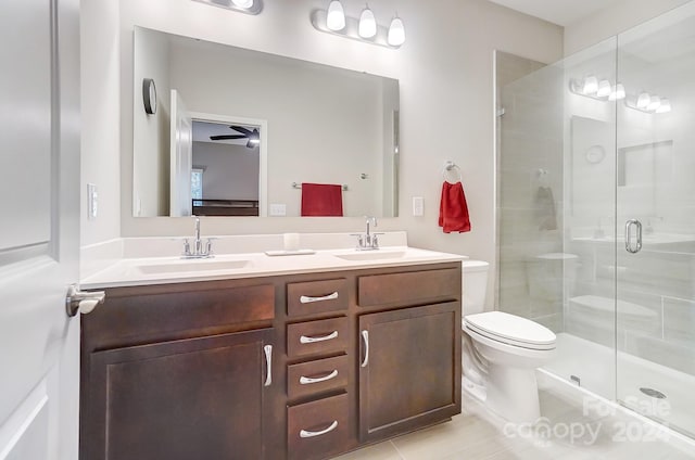 bathroom featuring ceiling fan, walk in shower, tile patterned floors, toilet, and vanity