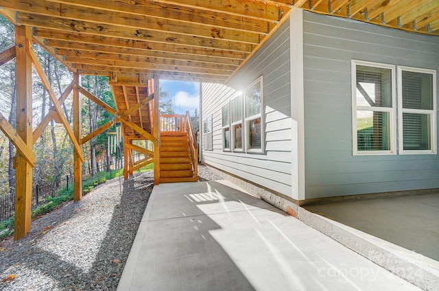 view of side of property with a patio area