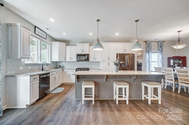 25622 Seagull Dr Unit 645, Lancaster, SC 29720 - kitchen with appliances with stainless steel finishes, healthy amount of natural light, a sink, white cabinets, and recessed lighting