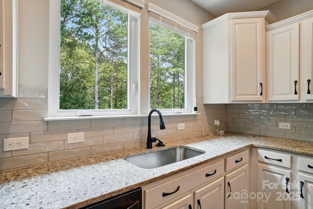 25622 Seagull Dr Unit 645, Lancaster, SC 29720 - kitchen featuring a sink, backsplash, white cabinets, and light stone counters