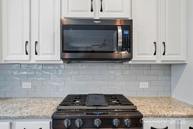 25622 Seagull Dr Unit 645, Lancaster, SC 29720 - kitchen featuring tasteful backsplash, white cabinetry, stove, and stovetop