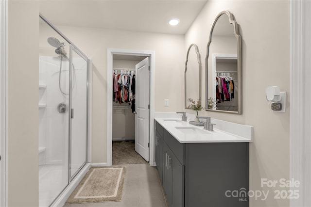 bathroom with vanity and an enclosed shower