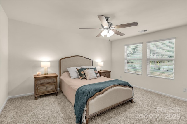 bedroom featuring light carpet and ceiling fan