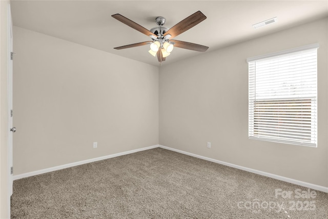 carpeted spare room with ceiling fan