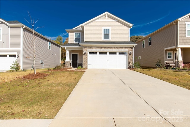 view of front facade featuring a front yard and a garage