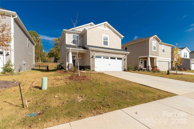 view of front of property with a garage and a front lawn