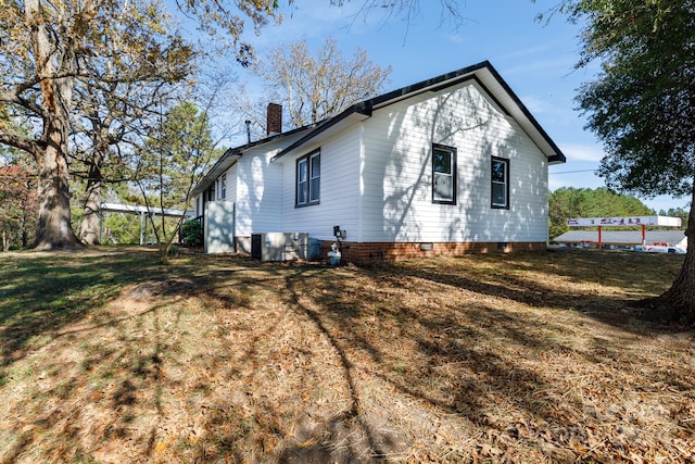 back of house with a yard