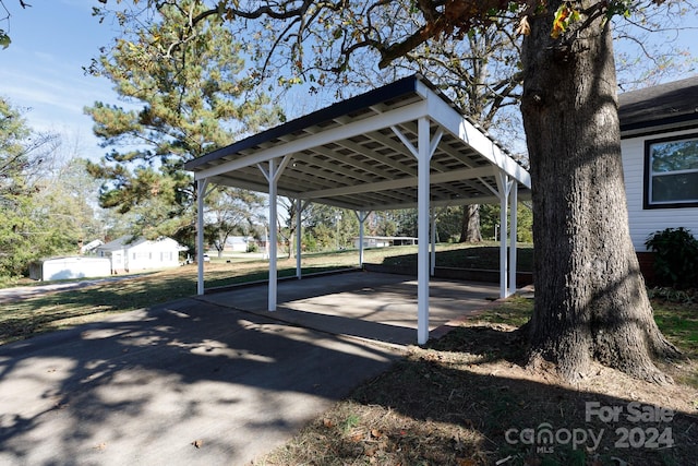 view of vehicle parking with a carport