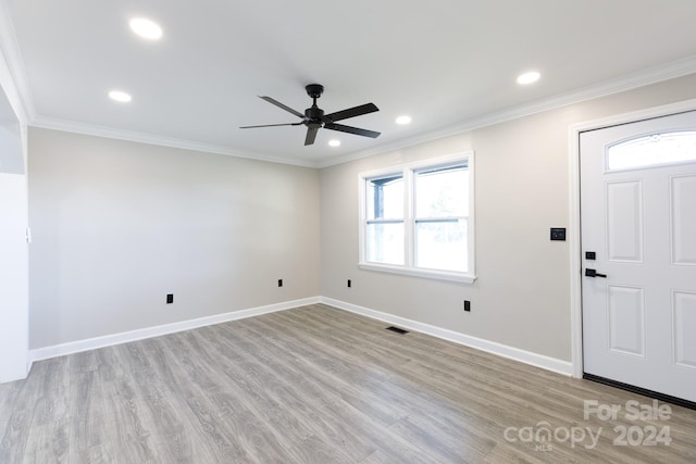 entryway featuring ceiling fan, light wood-type flooring, and crown molding