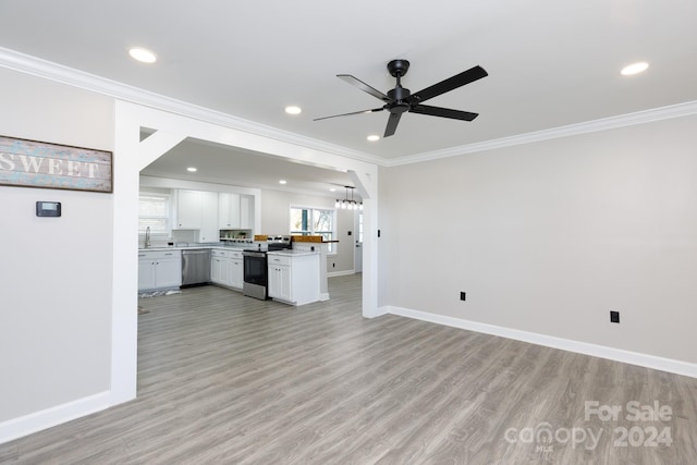 kitchen featuring stainless steel appliances, crown molding, light wood-type flooring, sink, and white cabinets