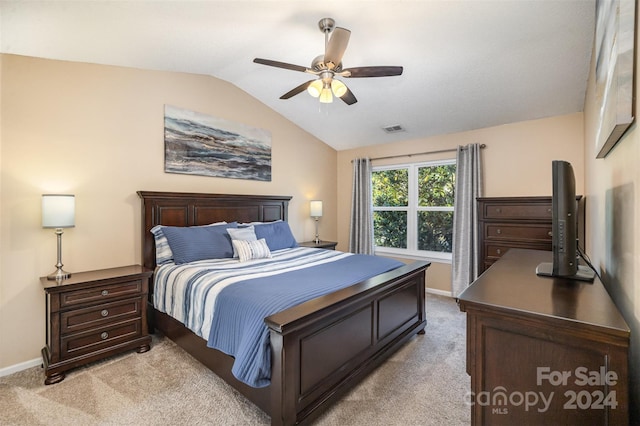 carpeted bedroom featuring lofted ceiling and ceiling fan